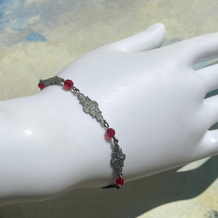 Red Austrian crystal bracelet with intricate filigree design from Owen Glass Collection, featuring elegant craftsmanship and sparkling crystals.