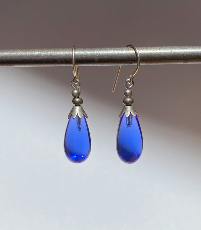 Silver Brights Sapphire German Glass Drop Earrings by Owen Glass Collection featuring shiny silver and blue glass drops.