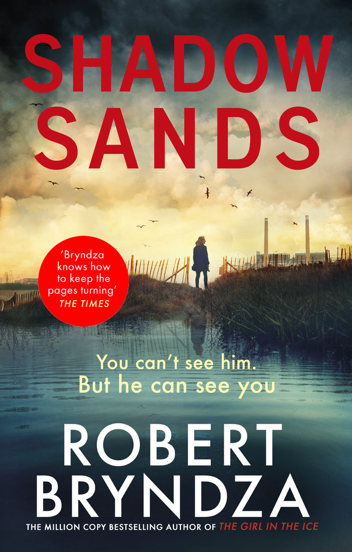 Book cover of 'Shadow Sands' by Robert Bryndza with a silhouette by a lake and red text.