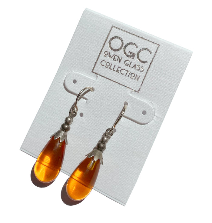 Silver Brights 4-inch Topaz glass dangle earrings by Owen Glass Collection with sparkling silver accents.