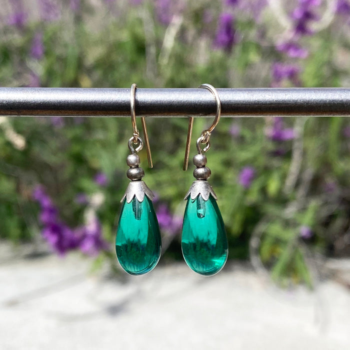Silver Brights 40-inch teal glass dangle earrings from Owen Glass Collection with shimmering silver accents.