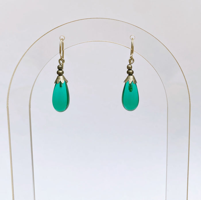 Silver Brights 40-inch teal glass dangle earrings from Owen Glass Collection, featuring elongated silver and teal glass design.