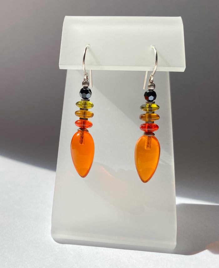 Orange glass dangle earrings from Owen Glass Collection with sleek, modern design featuring vibrant glass drops.