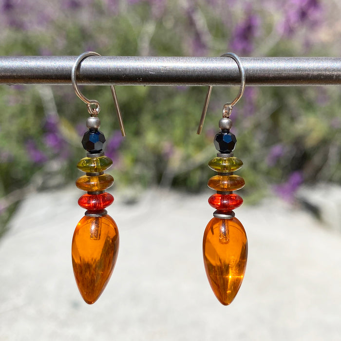 Orange glass dangle earrings from Owen Glass Collection, featuring the Tango 8 design with sleek, vibrant glass teardrop shapes.