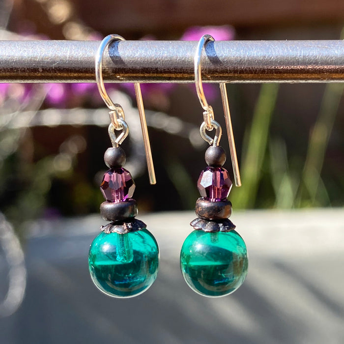Teal and amethyst glass and Austrian crystal earrings from Owen Glass Collection, featuring bubble-shaped design and sparkling accents.