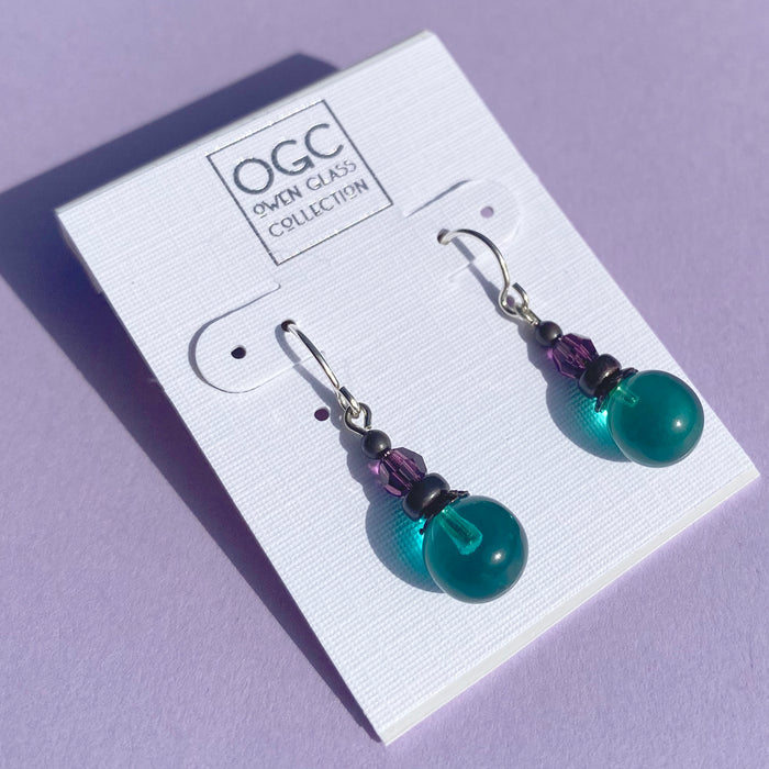 Teal and amethyst glass and Austrian crystal earrings from Owen Glass Collection, featuring bubble-shaped design and sparkling accents.