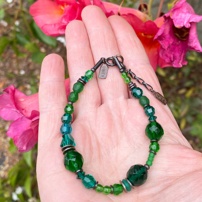Teal and emerald crystal and Czech glass beaded bracelet from Owen Glass Collection, featuring intricate beadwork and vibrant colors.