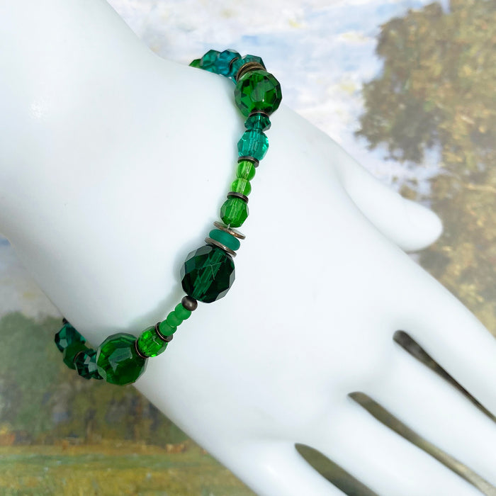 Teal and emerald crystal and Czech glass beaded bracelet from Owen Glass Collection with intricate beadwork and vibrant colors.