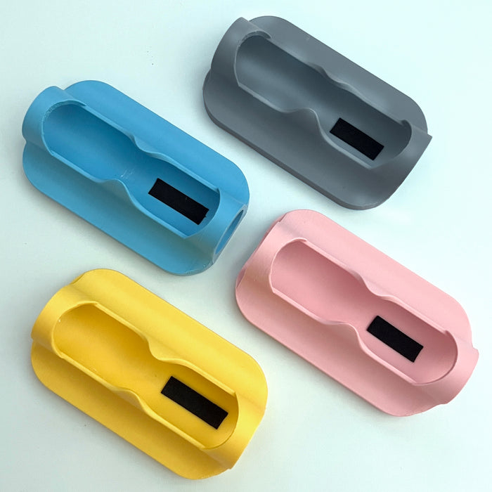 A plastic magsafe compatible power bank sleeves and Fuel Rod holders for theme park external chargers.