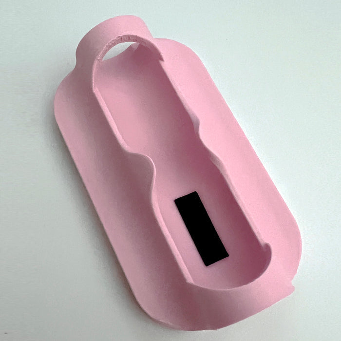A pink plastic magsafe compatible power bank sleeve and Fuel Rod holder for theme park external chargers.