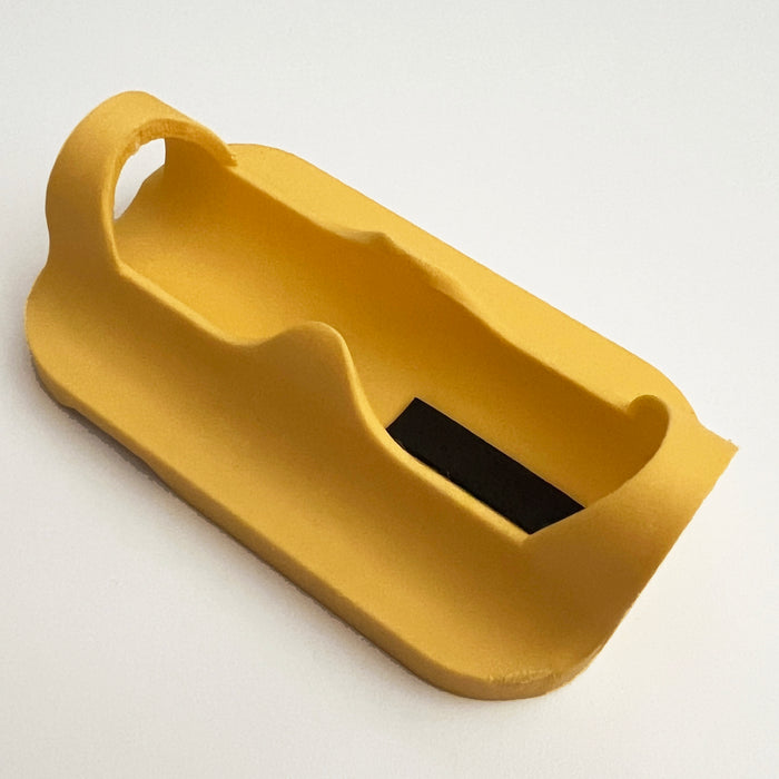 A yellow plastic magnetic power bank sleeve and Fuel Rod holder for theme park external chargers.
