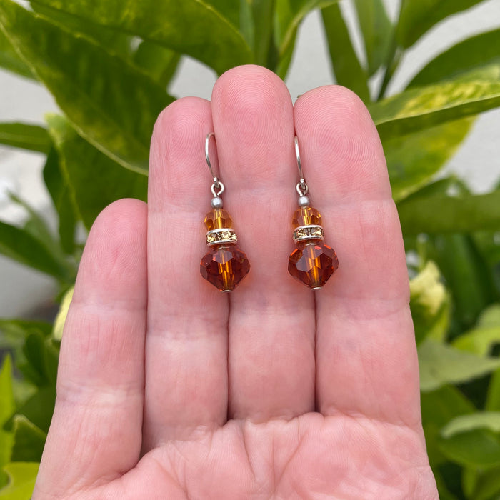 Owen Glass Collection Topaz crystal and rhinestone dangle earrings with intricate design and sparkling gemstones.