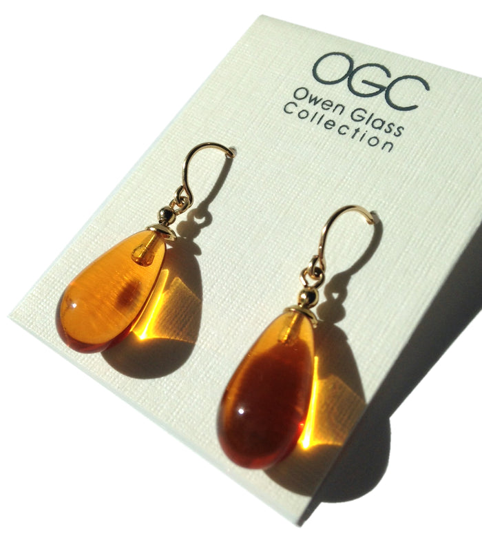 Gold and German glass dangle earrings with bright, colorful Topaz accents from Owen Glass Collection, showcasing intricate design.