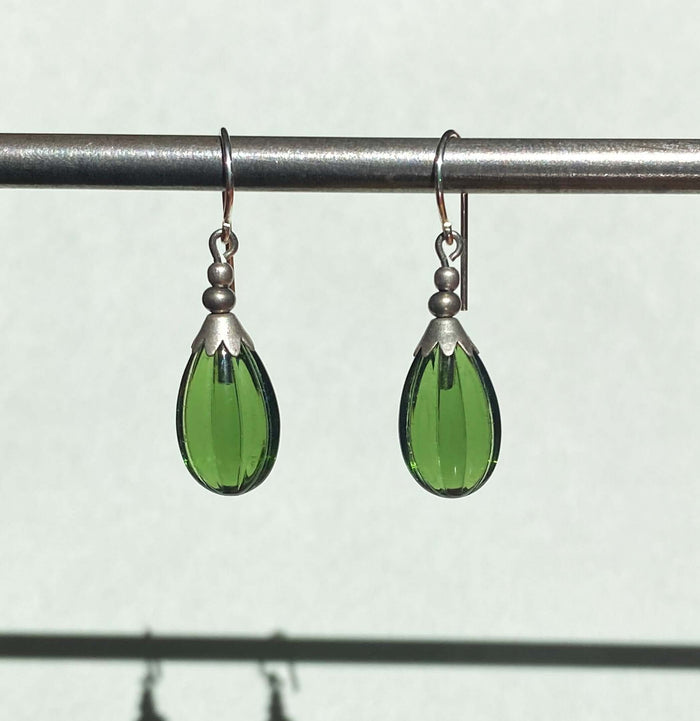 Green tourmaline German glass drop earrings featuring seedpod design from Owen Glass Collection, showcasing elegant handcrafted jewelry.