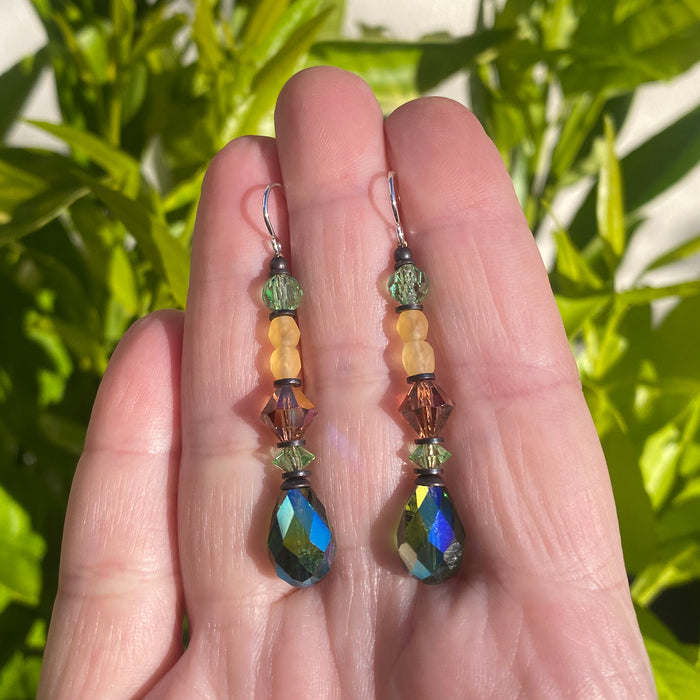 Owen Glass Collection turquoise green iridescent crystal earrings with a delicate dangling design and silver hooks.