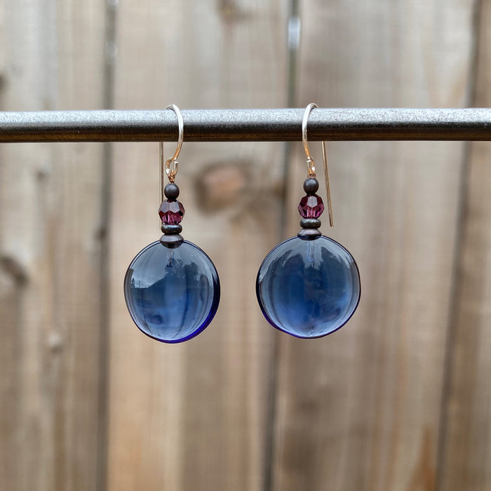 Indigo blue glass and amethyst crystal earrings from Owen Glass Collection featuring Windows 12 design on elegant earrings.